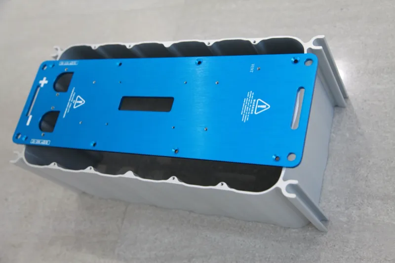 Aluminum alloy battery housing and capacitor enclosure